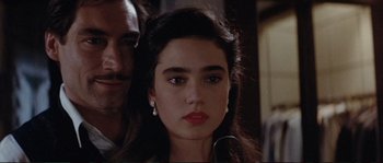 Movie still from “The Rocketeer” (1991), directed by Joe Johnston – A person wearing a suit and tie; Close Up shot, Over the shoulder angle