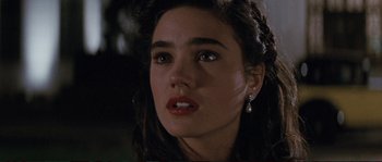 Movie still from “The Rocketeer” (1991), directed by Joe Johnston – A person wearing a earring; Close Up shot, Over the shoulder angle