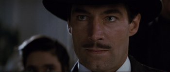 Movie still from “The Rocketeer” (1991), directed by Joe Johnston – A man with a mustache wearing a black hat; Close Up shot, Low angle