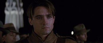 Movie still from “The Rocketeer” (1991), directed by Joe Johnston – A person wearing a brown jacket; Close Up shot, Over the shoulder angle