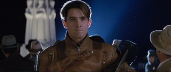 Movie still from “The Rocketeer” (1991), directed by Joe Johnston – A person wearing a leather jacket; Close Up shot, Low angle