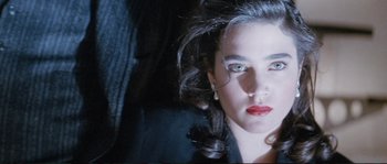 Movie still from “The Rocketeer” (1991), directed by Joe Johnston – A person wearing a suit and tie; Close Up shot, High angle