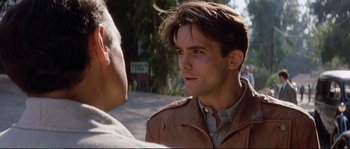 Movie still from “The Rocketeer” (1991), directed by Joe Johnston – A man in a brown jacket talking to another man in a brown jacket; Close Up shot, Over the shoulder angle