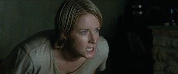 Movie still from “The Rover” (2014), directed by David Michôd – A person with short blonde hair; Close Up shot, Low angle