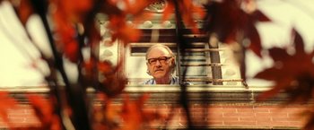 Movie still from “The Royal Tenenbaums” (2001), directed by Wes Anderson – An older man looking out of a train window; Close Up shot, Low angle