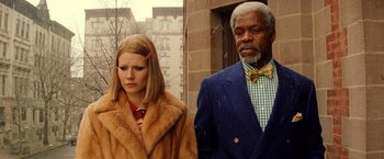 Movie still from “The Royal Tenenbaums” (2001), directed by Wes Anderson – A man and a woman standing next to each other; Close Up shot, Low angle