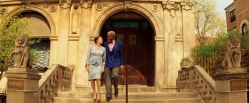 Movie still from “The Royal Tenenbaums” (2001), directed by Wes Anderson – A man and a woman walking down the sidewalk; Wide shot, Low angle