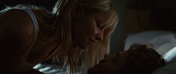 Movie still from “The Ruins” (2008), directed by Carter Smith – A young woman is kissing a young man's face; Close Up shot, Low angle