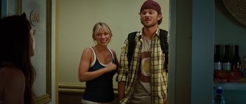 Movie still from “The Ruins” (2008), directed by Carter Smith – A man and a woman standing next to each other; Medium shot, Low angle