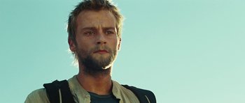 Movie still from “The Ruins” (2008), directed by Carter Smith – A person with a beard; Close Up shot, Low angle