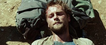 Movie still from “The Ruins” (2008), directed by Carter Smith – A person holding an umbrella; Close Up shot, Low angle