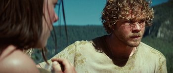 Movie still from “The Ruins” (2008), directed by Carter Smith – A man with curly hair is talking to another man; Close Up shot, Over the shoulder angle