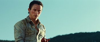 Movie still from “The Ruins” (2008), directed by Carter Smith – A young man with blood all over his face and chest; Close Up shot, Low angle