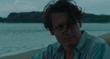 Movie still from “The Rum Diary” (2011), directed by Bruce Robinson – A person with long hair; Close Up shot, Over the shoulder angle