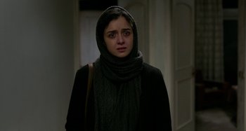 Movie still from “The Salesman” (2016), directed by Asghar Farhadi – A young woman wearing a head scarf and a black jacket; Close Up shot, Over the shoulder angle