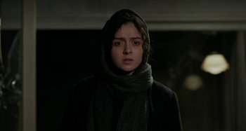Movie still from “The Salesman” (2016), directed by Asghar Farhadi – A woman wearing a black coat and a black scarf; Close Up shot, Low angle