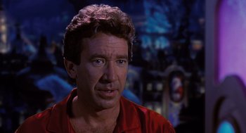 Movie still from “The Santa Clause” (1994), directed by John Pasquin – A person wearing a red shirt; Close Up shot, Over the shoulder angle