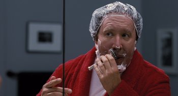 Movie still from “The Santa Clause” (1994), directed by John Pasquin – A man shaving his face with a razor; Close Up shot, Over the shoulder angle