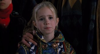 Movie still from “The Santa Clause” (1994), directed by John Pasquin – A little girl with her hand on her shoulder; Close Up shot, Over the shoulder angle