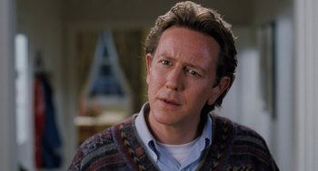 Movie still from “The Santa Clause” (1994), directed by John Pasquin – A person wearing a sweater; Close Up shot, Over the shoulder angle