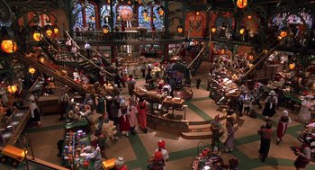 Movie still from “The Santa Clause 2” (2002), directed by Michael Lembeck – A large group of people in a large room; Extreme Wide shot, High angle