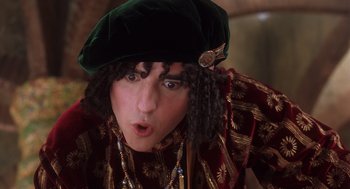 Movie still from “The Santa Clause 2” (2002), directed by Michael Lembeck – A man in a green hat and a red and gold jacket; Close Up shot, Low angle
