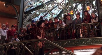 Movie still from “The Santa Clause 2” (2002), directed by Michael Lembeck – A group of people standing on top of a metal railing; Wide shot, High angle