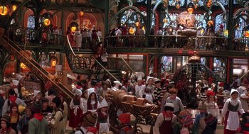 Movie still from “The Santa Clause 2” (2002), directed by Michael Lembeck – A group of people standing in a room; Extreme Wide shot, High angle