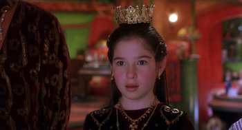 Movie still from “The Santa Clause 2” (2002), directed by Michael Lembeck – A young girl wearing a crown and a necklace; Close Up shot, Over the shoulder angle