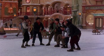 Movie still from “The Santa Clause 2” (2002), directed by Michael Lembeck – A group of people standing on top of a snow covered ground; Wide shot, High angle