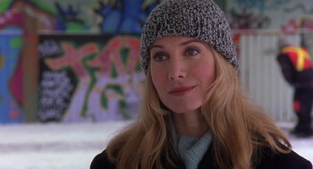 Movie still from “The Santa Clause 2” (2002), directed by Michael Lembeck – A woman wearing a hat and a sweater; Close Up shot, Over the shoulder angle