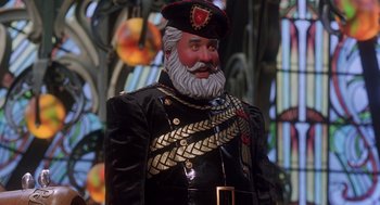 Movie still from “The Santa Clause 2” (2002), directed by Michael Lembeck – A statue of a man dressed in a uniform and wearing a hat; Close Up shot, Low angle