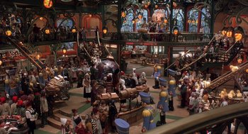 Movie still from “The Santa Clause 2” (2002), directed by Michael Lembeck – A group of people standing in a room; Extreme Wide shot, High angle