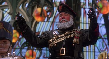 Movie still from “The Santa Clause 2” (2002), directed by Michael Lembeck – A man dressed as a man with a beard and a hat; Close Up shot, Low angle