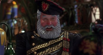 Movie still from “The Santa Clause 2” (2002), directed by Michael Lembeck – The face of a statue of a man in a military uniform; Close Up shot, Low angle