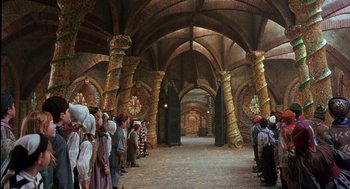 Movie still from “The Santa Clause 2” (2002), directed by Michael Lembeck – A group of people standing in front of an archway; Extreme Wide shot, High angle