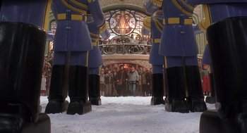 Movie still from “The Santa Clause 2” (2002), directed by Michael Lembeck – A group of people standing in front of a crowd; Wide shot, Low angle