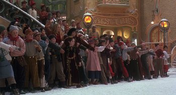 Movie still from “The Santa Clause 2” (2002), directed by Michael Lembeck – A group of people standing in front of a building; Wide shot, High angle