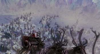 Movie still from “The Santa Clause 2” (2002), directed by Michael Lembeck – An aerial view of an area with a lot of trees and mountains; Extreme Wide shot, High angle