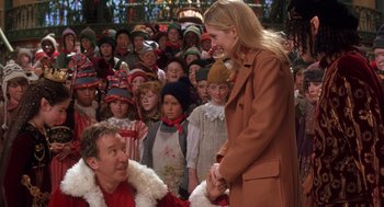 Movie still from “The Santa Clause 2” (2002), directed by Michael Lembeck – A man and a woman in front of a group of people; Medium shot, Over the shoulder angle