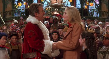 Movie still from “The Santa Clause 2” (2002), directed by Michael Lembeck – A man and a woman are shaking hands in front of a crowd of onlookers; Medium shot, Over the shoulder angle