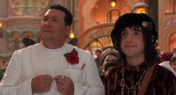 Movie still from “The Santa Clause 2” (2002), directed by Michael Lembeck – A man and a woman standing next to each other; Close Up shot, Low angle