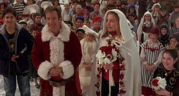 Movie still from “The Santa Clause 2” (2002), directed by Michael Lembeck – A man and a woman dressed as santa and mrs; Medium shot, Over the shoulder angle