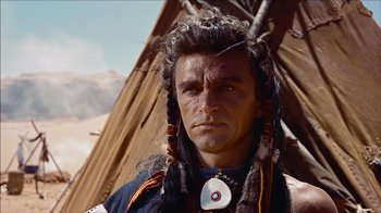 Movie still from “The Searchers” (1956), directed by John Ford – A person wearing a headdress; Close Up shot, Low angle