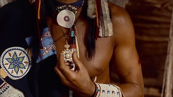 Movie still from “The Searchers” (1956), directed by John Ford – A person holding a cell phone; Close Up shot, Low angle