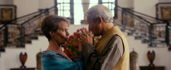 Movie still from “The Second Best Exotic Marigold Hotel” (2015), directed by John Madden – An older man and a younger woman holding hands; Medium shot, Over the shoulder angle