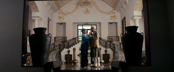 Movie still from “The Second Best Exotic Marigold Hotel” (2015), directed by John Madden – A couple of people that are standing in a room; Wide shot, Low angle