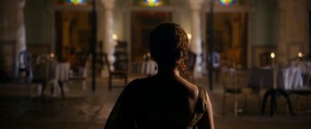 Movie still from “The Second Best Exotic Marigold Hotel” (2015), directed by John Madden – The back of a woman's head in the dark; Medium shot, Over the shoulder angle