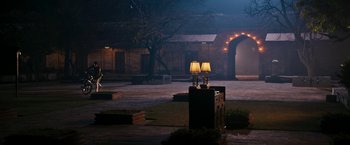Movie still from “The Second Best Exotic Marigold Hotel” (2015), directed by John Madden – A couple of lamps on top of a wooden box; Extreme Wide shot, High angle