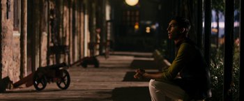 Movie still from “The Second Best Exotic Marigold Hotel” (2015), directed by John Madden – A man sitting on a bench in the dark; Medium shot, High angle
